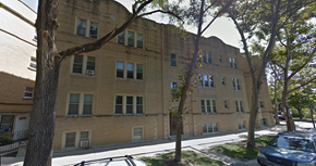 Chicago apartment for rent - a large brick building with trees in front of it