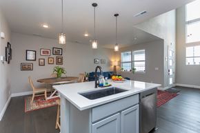 Colorado Springs house for rent - A kitchen with a white counter top and a sink.