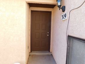 Fountain house for rent - A brown door with a number 319 above it.