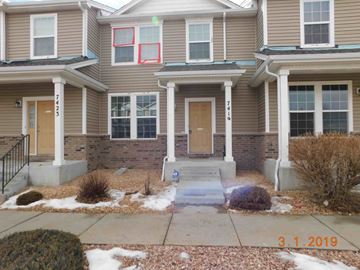 Fountain house for rent - A house with a brown siding and a red square on the window.
