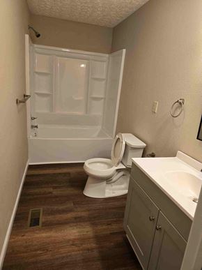 Ashland house for rent - a bathroom with a toilet and a sink and a shower