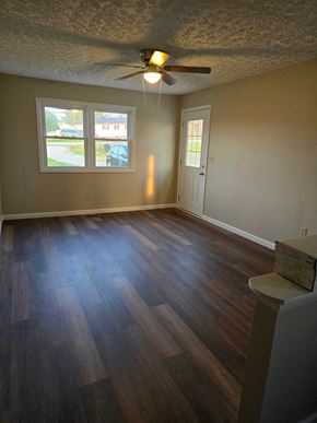 Ashland house for rent - a living room with a wood floor and a ceiling fan