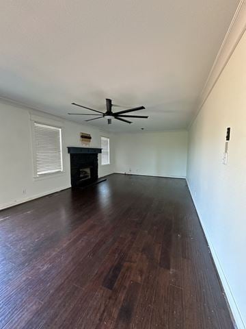 Clarksville house for rent - an empty living room with wood floors and a ceiling fan