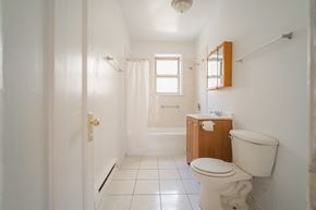 Chicago apartment for rent - a bathroom with a toilet and a sink and a shower