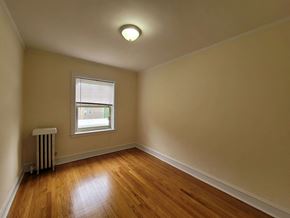 Chicago apartment for rent - a living room with wood floors and a window