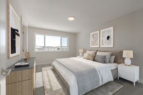 Calgary apartment for rent - a bedroom with a bed and a window