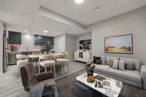 Calgary apartment for rent - a living room and kitchen with a couch and a table