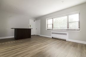Evanston apartment for rent - the living room of a house with wood flooring and a large window
