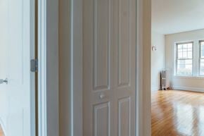 Chicago apartment for rent - the door is open to a living room with a hard wood floor