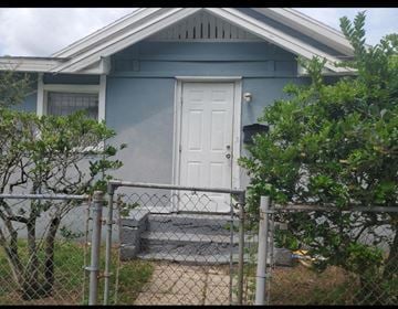 Jacksonville house for rent - a blue house with a white door and a fence