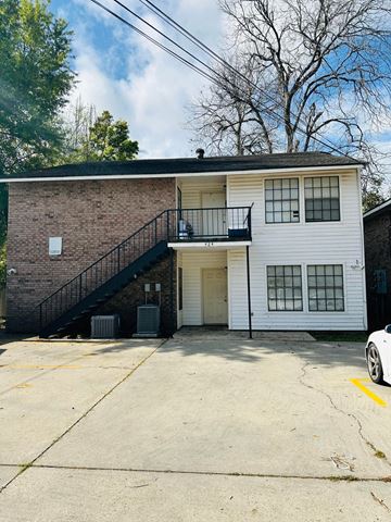 Lafayette apartment for rent - a white building with a staircase on the side of it