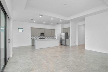 Estero house for rent - the living room and kitchen of a new home with no furniture