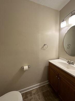 Clarksville house for rent - a small bathroom with a toilet and a sink