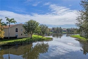 Bonita Springs house for rent - a house next to a body of water with trees