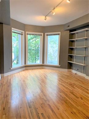 Chicago apartment for rent - a living room with a hard wood floor and a large window