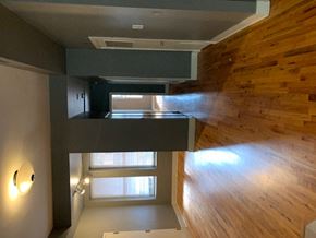 Chicago apartment for rent - an overhead view of a loft with a wood floor