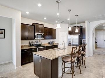 Estero house for rent - a kitchen with a bar and a table with chairs