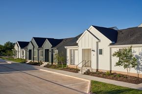 Leander apartment for rent - A row of houses with grey and white exteriors.