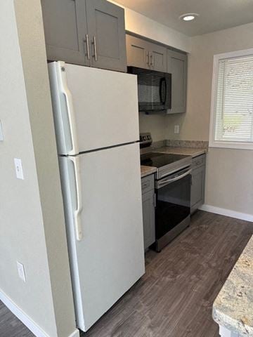 Seattle house for rent - a kitchen with a refrigerator and a stove and a microwave