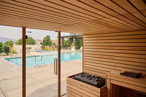 Missoula apartment for rent - A wooden sauna is next to a pool.