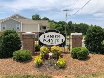 Shelby apartment for rent - a lanier point ii sign in front of a house