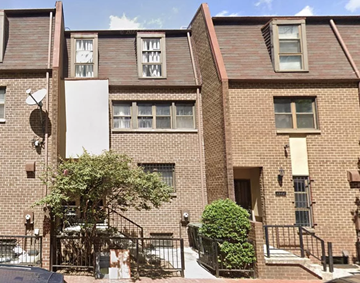Washington apartment for rent - a brick apartment building with stairs and a sidewalk