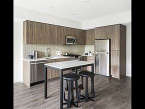 Oakland apartment for rent - A kitchen with a table and two stools.