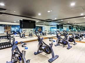 Oakland apartment for rent - A gym with stationary bikes and a mirror.