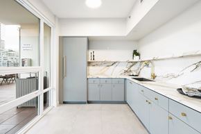 San Diego apartment for rent - A kitchen with a refrigerator, cabinets, and a countertop.