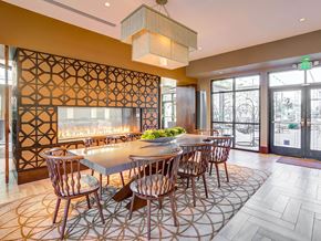Pleasanton apartment for rent - A dining room with a large table and chairs.