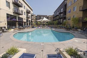 Mountain View apartment for rent - A swimming pool in a courtyard surrounded by buildings.