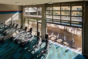 Mountain View apartment for rent - A gym with a row of treadmills and exercise bikes.