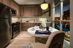 Los Angeles apartment for rent - A modern kitchen with a dining table set for two.