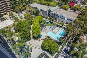 Los Angeles apartment for rent - A bird's eye view of a residential area with a swimming pool.