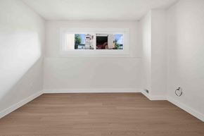 Calgary apartment for rent - A white room with a picture frame on the wall.