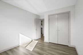 Calgary apartment for rent - A room with a white door and a white cabinet.