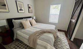 Flagstaff apartment for rent - a bedroom with a bed and some pillows on it