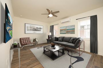 Durham apartment for rent - a living room with a couch and a ceiling fan