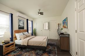 Durham apartment for rent - a bedroom with a bed and a ceiling fan