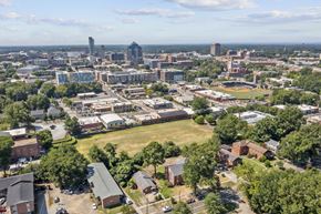Durham apartment for rent - an aerial view of the city with a field in the foreground