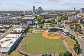 Durham apartment for rent - an aerial view of a baseball field with a city in the background