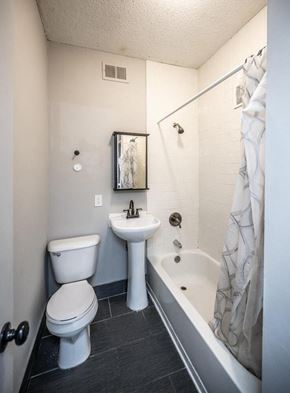 Minneapolis apartment for rent - a bathroom with a sink toilet and a tub