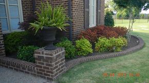 Cathedral City house for rent - a potted plant sitting on top of a brick retaining wall