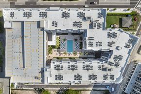 Miami apartment for rent - arial view of the roof of a building with a blue door