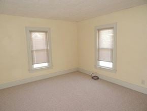 South Bend apartment for rent - A room with two windows and a white ceiling.