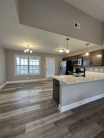 Clarksville house for rent - an open kitchen and living room with a counter top