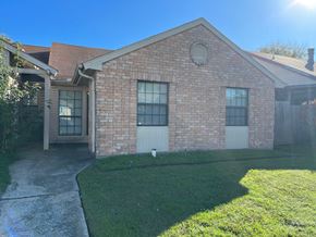 Arlington house for rent - A brick house with a white door and windows.