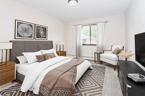 Hudson apartment for rent - a bedroom with a bed and a tv