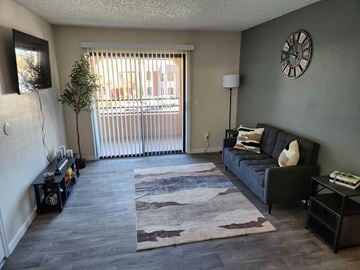 Mesa apartment for rent - a living room with a couch and a sliding glass door