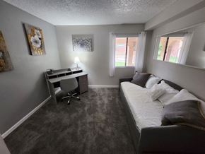 Mesa apartment for rent - a small bedroom with a bed and a desk